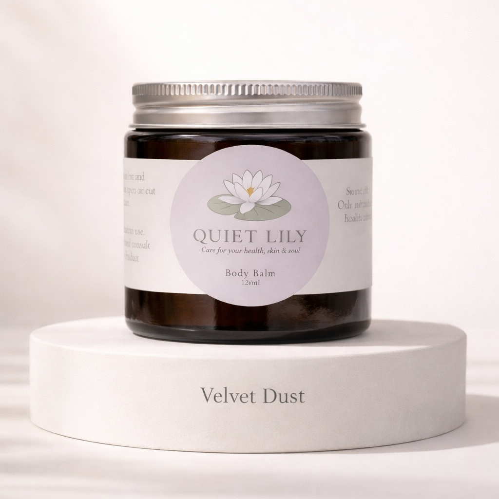Jar of 'Quiet Lily' body balm on a white pedestal with a light pink background